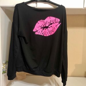 80s style off the shoulder slouchy sweatshirt.